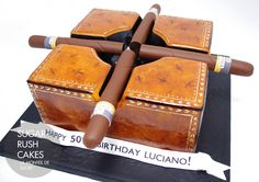 a birthday cake made to look like cigars