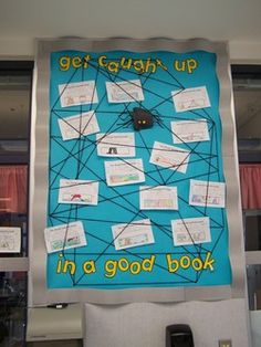 a bulletin board that says get caught up in a good book