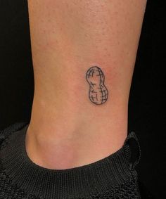 a small tattoo on the ankle of a woman