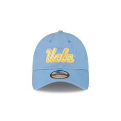 a light blue hat with the word, wela in yellow and white on it