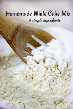 homemade white cake mix in a bowl with a wooden spatula on the side and text overlay that reads homemade white cake mix 6 simple ingredients