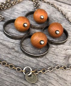 "Mid Century Modern Kaija Aarikka 1960s Pendant Necklace Marked \"Kaija Aarikka Finland\" MCM / Brutalist / Boho Style Pendant is made up by four beige/brown wooden balls and metal circles around them. It has a nice patina, which could be polished if so desired, and I believe it is silver plated. The chain is original Aarikka and it is marked. Please note that the wooden balls are not as yellow as they appear in some pictures but more of a beige/brown color and the most true color is in pic 7 an Handmade Retro Brown Necklaces, Retro Handmade Brown Necklaces, Retro Brown Handmade Necklaces, Handmade Vintage Brown Jewelry, Unique Nickel Free Brown Necklaces, Vintage Brown Nickel-free Necklace, Beige Brown Color, 60s Jewelry, Plate Design