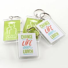 three key chains with different sayings on them, one for change and the other for lunch