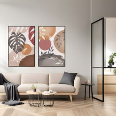 a living room with two paintings on the wall