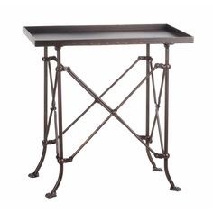 an iron table with a black tray on the top and metal legs, against a white background