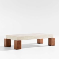 a white marble and wood coffee table with two brown wooden legs on an isolated background