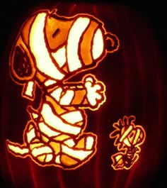 a carved pumpkin with an image of a clown on it