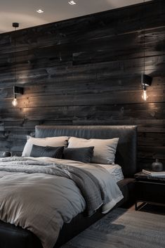 a large bed sitting next to a wooden wall