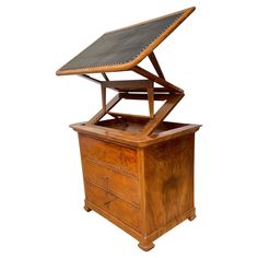 an old wooden desk with a leather top on it's shelf and bottom drawer