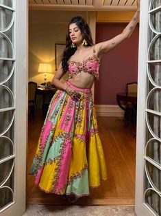 Editor's Note A Tri-colour Panelled Half Lehenga Embellished In Pink, Yellow & Mint Raw Silk, Embroidered With Glass Stones, Metal Pieces, And Glass Cut Beads. Paired With An Original Papa Dont Preach Pink Butterfly Blouse With 3d Embroidery. Note: This Product Is Exclusively Hand Crafted Using Multiple Techniques, Individually Handled At Different Stages, Any Irregularities Must Be Taken As An Intrinsic Part Of Its Natural Process. Color: Pink, Yellow & Mint Fabric: Raw Silk Neckline: Sweethear Papadontpreach Lehenga, Dreamy Lehenga, Haldi Carnival, Half Lehenga, Lehenga With Blouse, Mint Fabric, Tri Colour, Butterfly Blouse, Indian Bridal Wear