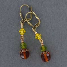 Sadie Green's Vintage Glass Earring Amber Czech Glass Drop Earrings, Vintage Wire Wrapped Dangle Jewelry, Brown Bead Caps For Jewelry Making, Bronze Czech Glass Jewelry With Ear Wire, Bronze Czech Glass Drop Earrings, Vintage Czech Glass Matching Earrings, Vintage Amber Drop Earrings, Vintage Gold Jewelry With Bead Caps, Amber Colored Nickel Free Czech Glass Jewelry