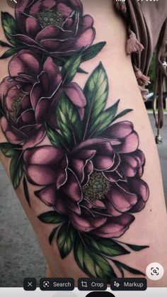 a woman's thigh with flowers on it