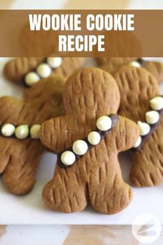 some cookies with white and brown icing are on a plate