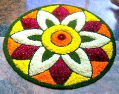 a colorful flower design is on the ground