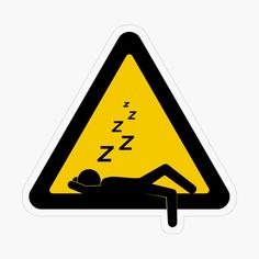 a yellow and black triangle shaped sign with a man sleeping on it's back