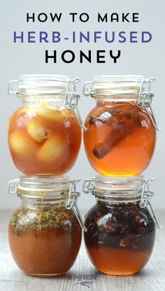 three jars filled with honey sitting on top of a table