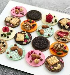 an assortment of cookies and pastries are arranged on a sheet of paper