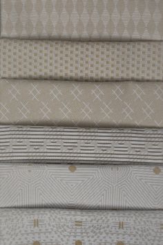 six different shades of fabric with gold dots and lines on them, all in various colors