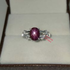 Band : Goldsmith Jewellers Material : 925 Sterling Silver Gemstone : 100% Natural Star Ruby Star Ruby Stone Weight : 3.15  Carat Star Ruby Stone Size : 6.87 x 8.70 MM Secondary Stone : Cubic Zirconia Zirconia Stone Weight : 0.16 Carat Zirconia Stone Size : 2.20 MM Gross Weight : 3.420 Gm Stone Shape : Oval, Round Stone Color : Red & White Ring Size : All Size Available Made to Order Please Give Your Opinion or Feedback About The Product https://www.etsy.com/in-en/your/shops/GoldsmithJewellers/onboarding/listings/create Star Ruby Ring, Ring Birthstone, Vintage Star, Star Ruby, Ruby Stone, Red Band, Star Ring, Women Ring, Ring Women