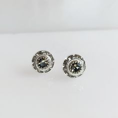 Black diamond post earrings Stunning crystal studs are perfect day or night. The black diamond Swarovski Crystal Chaton is surrounded by slightly lighter but still silver channeled crystals. Each entire setting is vintage (and hard to find) measuring 8mm (.25") in diameter and is adhered to silver tone ear posts. Perfect for adding sparkle to every day or for a special occasion. *The third picture is for sizing not the same shade as listed. Copyright ©, all rights reserved. LoveYourBling® is an Granada, Black Diamond, The Vintage, Swarovski Crystal, Post Earrings, Swarovski Crystals, Diamond Earrings, Silver Tone, Special Occasion