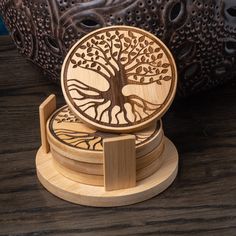 a wooden coaster with a tree on it