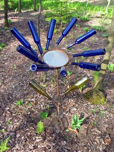 a tree with blue glass bottles in the shape of a sunburst on it