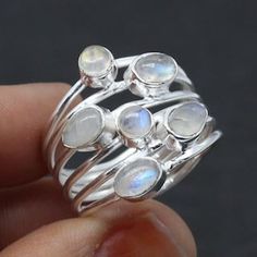 Elevate your style with our stunning Rainbow Moonstone ring. This handcrafted beauty features a mesmerizing Rainbow Moonstone set in a splendid sterling silver ring. *Captivating Colors: The Rainbow Moonstone's iridescent play of colours adds a touch of magic to your look. Each stone is carefully chosen for its unique charm. *Celestial Charm: The sterling silver moonstone setting adds a celestial touch, showcasing the moonstone in an elegant and timeless design. *Handcrafted Beauty: made by skilled artisans, each ring is a work of art that brings a special touch to your style. *Versatile Elegance: Whether for special occasions or everyday wear, this Moonstone ring is a versatile piece that adds a hint of mystique to any outfit. *Perfect Fit: Available in various sizes, ensuring a comfortab Big Wedding Rings, Strengthening Intuition, Huge Rings, Ring Moonstone, 925 Silver Ring, White Band, Silver Style, Multi Stone Ring, Moonstone Ring