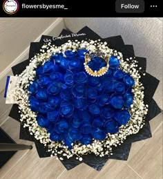 a bouquet of blue roses on top of a table