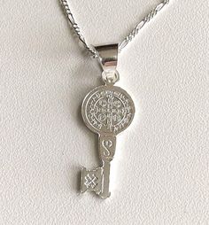 "925 STERLING SILVER SAINT BENEDICT KEY NECKLACE 20\" LONG... FOR GOOD LUCK ,PROSPERITY AND PROTECTION. MADE IN ITALY-BEST QUALITY PENDANT : 32x11mm CADENA DE SAN BENITO EN 925 PLATA ESTERLINA 20\" LARGO .. PARA PROSPERIDAD, BUENA SUERTE Y PROTECCION. HECHO EN ITALIA-MEJOR CALIDAD DIJE: 32x11mm" Silver Key Pendant Jewelry, Silver Key Necklace For Gift, Silver Pendant Necklace With Two Keys, Silver Key Pendant Necklace, Silver Engraved Charm Necklace For Good Luck, Good Luck Silver Engraved Charm Necklaces, Good Luck Silver Engraved Charm Necklace, Personalized Silver Jewelry For Good Luck, Good Luck Engraved Silver Charm Necklace