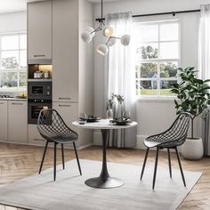 a modern kitchen and dining room with white walls