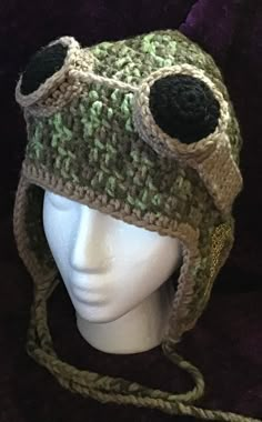 a crocheted hat on top of a mannequin head