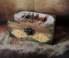 there is a small box with horses on it