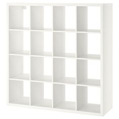 a white bookcase with many cubes on it's sides and one section missing