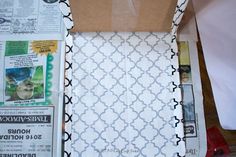 the inside of a box with newspaper and paper