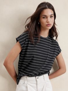 Striped Dolman-Sleeve T-Shirt | Banana Republic Factory Casual Workwear T-shirt With Shirttail Hem, Relaxed Black Tops For Everyday, Relaxed Black Top For Everyday, Casual Batwing Sleeve Tops For Work, Casual Relaxed Fit Crew Neck Top, Casual Cotton Tops With Curved Hem, Cotton Batwing Sleeve Tops For Everyday, Trendy Tops With Relaxed Fit And Batwing Sleeves, Relaxed Fit Top With Shirttail Hem