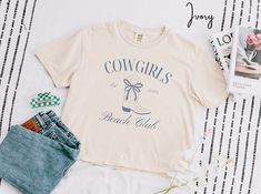 Cowgirls Beach Club Comfort Colors Shirt  * Q U I C K * F A C T S * ✺ Each sweatshirt comes with a relaxed fit, a rolled-forward shoulder, and a back neck patch. ✺ 80% ring-spun cotton, 20% polyester ✺ Relaxed fit ✺ OEKO-TEX certified low-impact dyes * S I Z I N G * ✺ Models have sized up for an oversized look | For an oversized look, we recommend sizing up at least 2 sizes ✺ Sizing is unisex so runs like men's, though not overly large ✺ Size guide listed in the listing photos provides exact mea Cute Beach Season Shirt, Coastal Cowgirl Bachelorette, Coquette Top, Cowgirl Bachelorette, Coastal Granddaughter, Cowgirl Shirts, Coconut Girl, Coastal Cowgirl, Cow Girl