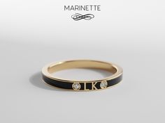 "Elegant, thin enamel band in solid gold and black enamel with 2 diamonds.  Choose 2 letters and display them on this beautiful band in 14K gold and black enamel. This ring is made to order, specially to your measurements. 2.5 mm wide. Available in yellow, white, or pink 14K gold. Just send me a message for more information.  IMPORTANT:  To avoid any mistake, please let me know the following information in the \"note to seller\" section when you order: - Ring size (please specify whether it is a Diamond Promise Ring, Elephant Ring, Diamond Promise Rings, Wide Rings, Wide Bands, Black Enamel, Promise Ring, Rings Statement, Gold Bands