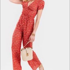 Red And Multicolor Jumpsuit With Floral Print Throughout And Short Sleeves With Tags Never Before Worn Chic Red Short Sleeve Jumpsuits And Rompers, Red Fitted V-neck Jumpsuit, Casual Red V-neck Jumpsuits And Rompers, Casual Red V-neck Jumpsuit, Chic Red Jumpsuits And Rompers For Summer, Casual Red Overall Jumpsuits And Rompers, Red Fitted Casual Jumpsuits And Rompers, Red Fitted Casual Jumpsuit/romper, Fitted Red Casual Jumpsuits And Rompers