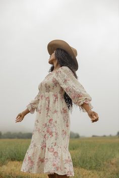 Printed in perfect florals, this midi dress features a smocked bodice, a tiered silhouette, and poet sleeves that can be worn on or off the shoulders for the dreamiest fit. Made of soft cotton and complete with eyelet detailing, this dress is the epitome of charming elegance. lined bodice and skirt unlined sleeves pockets // paired with the free people new frontier western boots in peru Cute Modest Dresses, Eyelet Dress, Everyday Dresses, Modest Dresses, Trendy Dresses, Western Boots, Summer Women, Fit And Flare, Shift Dress