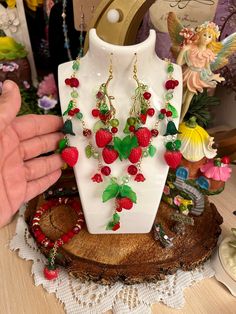 Strawberry Necklace, Earring and Bracelet set, Fruit Jewelry, Summer Jewelry, Jewelry Set, Beaded Jewelry, Colorful 🍓Strawberry charm earring, bracelet  and necklace set 🛍️ 🍓Strawberry Fairycore Dangle Earrings and beaded dangle chain necklace with extender 🍃 🍓Summer is almost here! Handmade strawberry charmed earrings and necklace with #czechbeads and cute green leaf charms 🍃 🌷Handmade with love  ☀️Perfect for Spring, Summer or any occassion!! The strawberry charms are vibrant in color a Handmade Multicolor Fantasy Jewelry, Handmade Fairy Dangle Jewelry, Handmade Fairy Style Dangle Jewelry, Fairycore Beaded Jewelry For Festivals, Fairycore Beaded Festival Jewelry, Festival Fairycore Beaded Jewelry, Handmade Adjustable Fairy Jewelry, Adjustable Beaded Fairycore Jewelry, Fantasy Beaded Jewelry As Gift