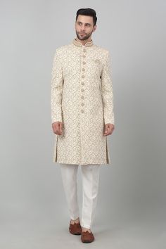 Ivory cotton sherwani with all over floral jaal pattern, metallic gold zardozi embroidery and bead work mandarin collar. Paired with kurta and straight fit pant. - Aza Fashions Gold Sherwani With Chikankari Embroidery, Designer Gold Sherwani With Chikankari Embroidery, Gold Raw Silk Sherwani With Chikankari Embroidery, Off White Sherwani With Cutdana, Cream Kurta With Gold Embroidery For Diwali, Gold Sherwani With Cutdana In Straight Kurta Style, Cream Sherwani With Chikankari Embroidery For Reception, Cream Kurta With Gold Embroidery And Traditional Drape, White Kurta With Gold Embroidery For Diwali