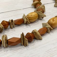 Wood Necklace, Tribal Wood Necklace, Wood Bead Necklace, Boho Wood Necklace, Unisex Wood Necklace, Wood Beaded Necklace, Mens Wood Necklace This funky wood necklace was hand beaded using a mix of large geometric wood beads in a variety of neutral colors and interesting shapes. A totally unique look with tribal, bohemian flair! The necklace measures approximately 26 inches long and is securely fastened with a silver clasp. Perfect for any gender! Length can be adjusted if needed - just ask :) Che Adjustable Rustic Wooden Beaded Necklaces, Rustic Adjustable Wooden Beaded Necklaces, Rustic Beaded Necklaces For Jewelry Making, Spiritual Brown Necklace With Spacer Beads, Rustic Brown Hand-strung Necklaces, Rustic Round Beads Necklace For Jewelry Making, Bohemian Brown Necklace With Oval Beads, Rustic Wooden Bead Necklaces For Festivals, Rustic Wooden Beads Necklace For Festival