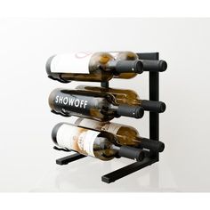 the wine rack is holding several bottles of wine