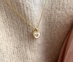 Dainty White Heart Necklace With Delicate Chain, Dainty White Heart Necklace For Her, White Heart Necklace With Clavicle Chain As Gift, White Heart Clavicle Chain Necklace As Gift, Feminine White Necklace For Valentine's Day, Dainty White Charm Necklaces With Heart Pendant, White Delicate Heart Pendant Necklace, Delicate White Heart Pendant Necklace, Feminine White Jewelry For Valentine's Day