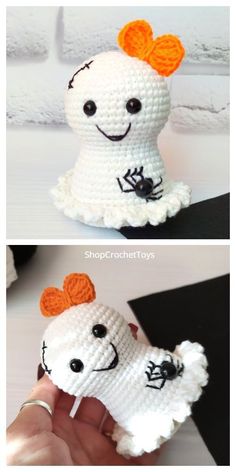 crocheted white doll with orange hair and black eyes holding it up to the camera