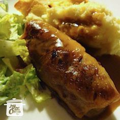 some food on a white plate with broccoli and mashed potatoes