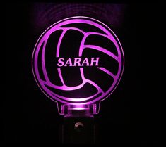 a light up volleyball ball with the word sarah on it's front and side