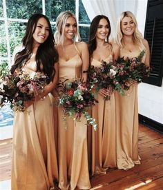 the bridesmaids are holding their bouquets and posing for a photo in front of a window