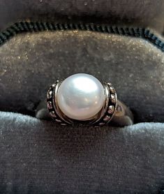 Signed Honora fine Sterling Silver Pearl ring. Ring has a beautiful modernist design and large 10mm Cultured Freshwater Pearl channel set. Ring is fully hallmarked and will arrive gift boxed. MARKS 925, Mark for Honora, China. CONDITION In very good to excellent condition with light wear. Please use all pictures as part of item's description. SIZE 6, ring could be resized by any good jeweler. MATERIALS Sterling Silver, Freshwater Cultured Pearl. Classic White Gold Jewelry With Stone Setting, Elegant Stamped 925 Round Band Ring, Elegant Round Band Ring Stamped 925, Classic Rings With Stone Setting, Formal Stackable Pearl Ring Fine Jewelry, Formal Stackable Pearl Ring, Fine Jewelry, Elegant Jewelry With Round Stone Setting, Elegant Adjustable Ring With Stone Setting, Elegant White Pearl Ring With Bezel Setting