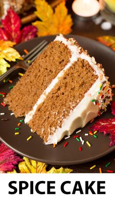 a slice of cake with white frosting and sprinkles on a plate